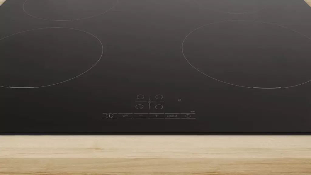 Официальное фото индукционной панели Bosch PUE611BB5E на столешнице